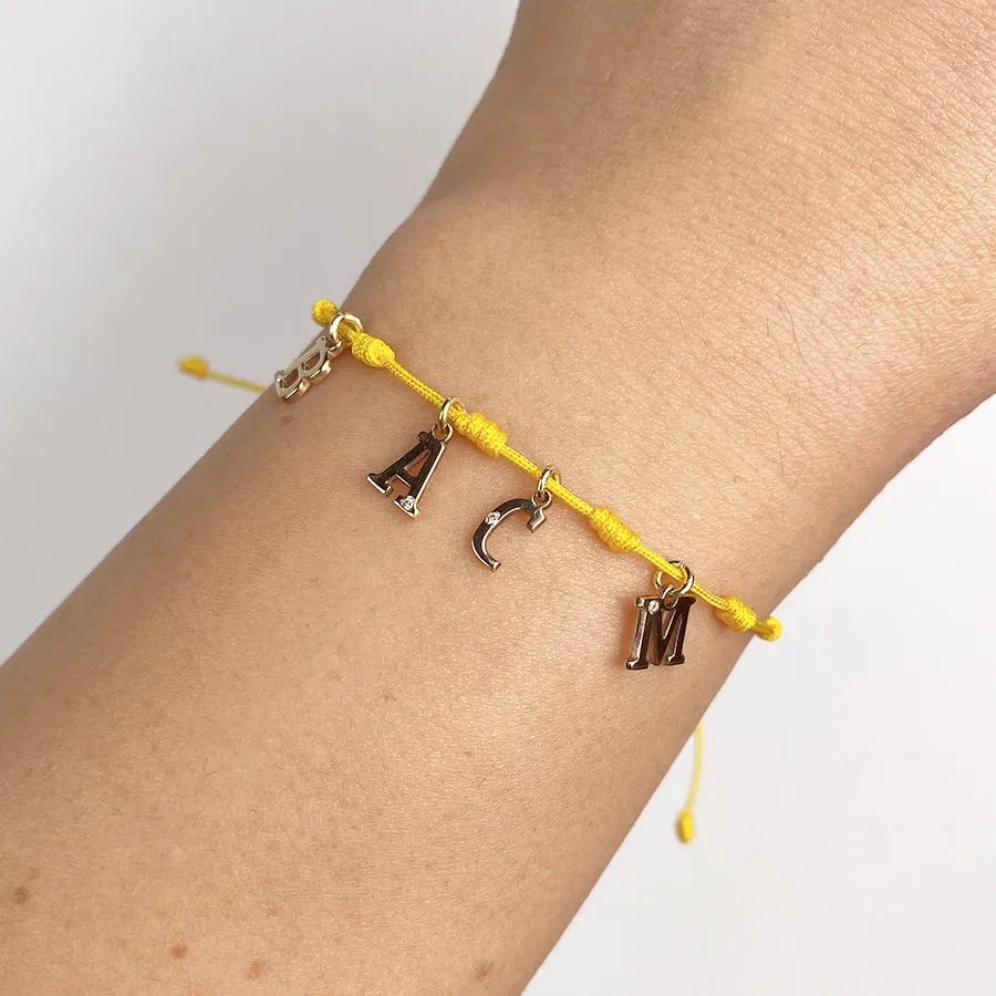 Pulsera con Inicial 7 nudos Amarilla 4 letras con Diamante y Oro